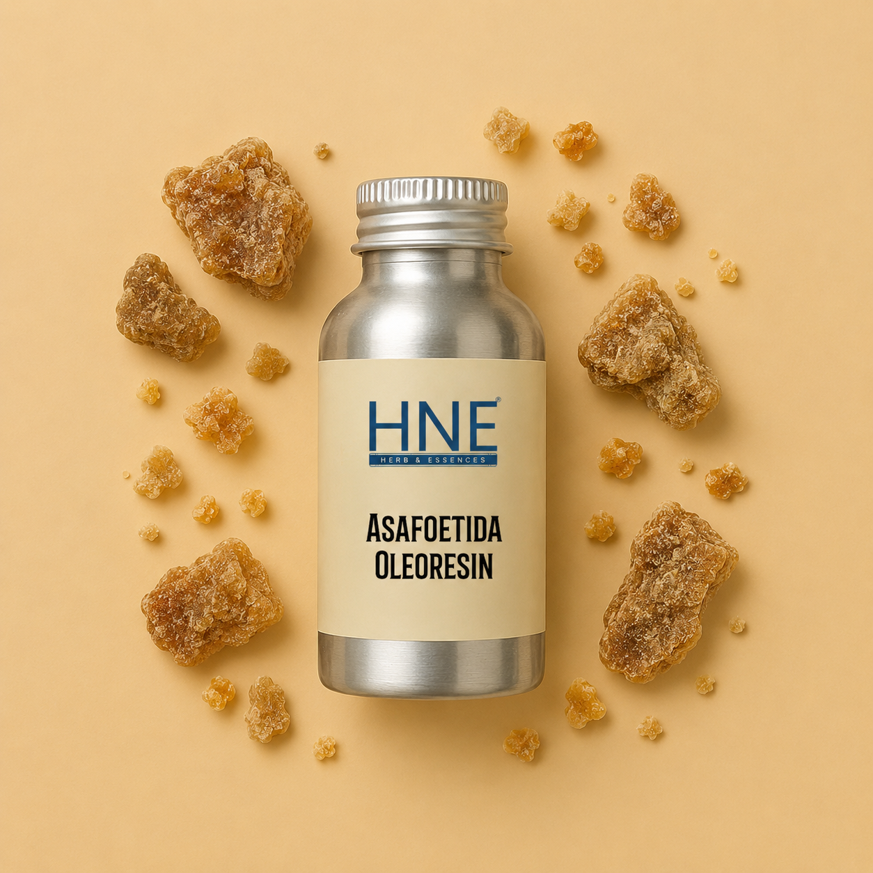 Bottle of HNE Asafoetida Oleoresin surrounded by asafoetida resin on a beige background