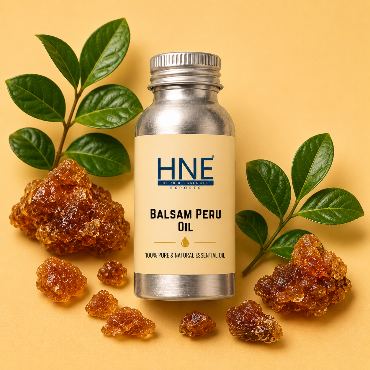 Bottle of HNE Balsam Peru Essential Oil with balsam resin and leaves on a yellow background