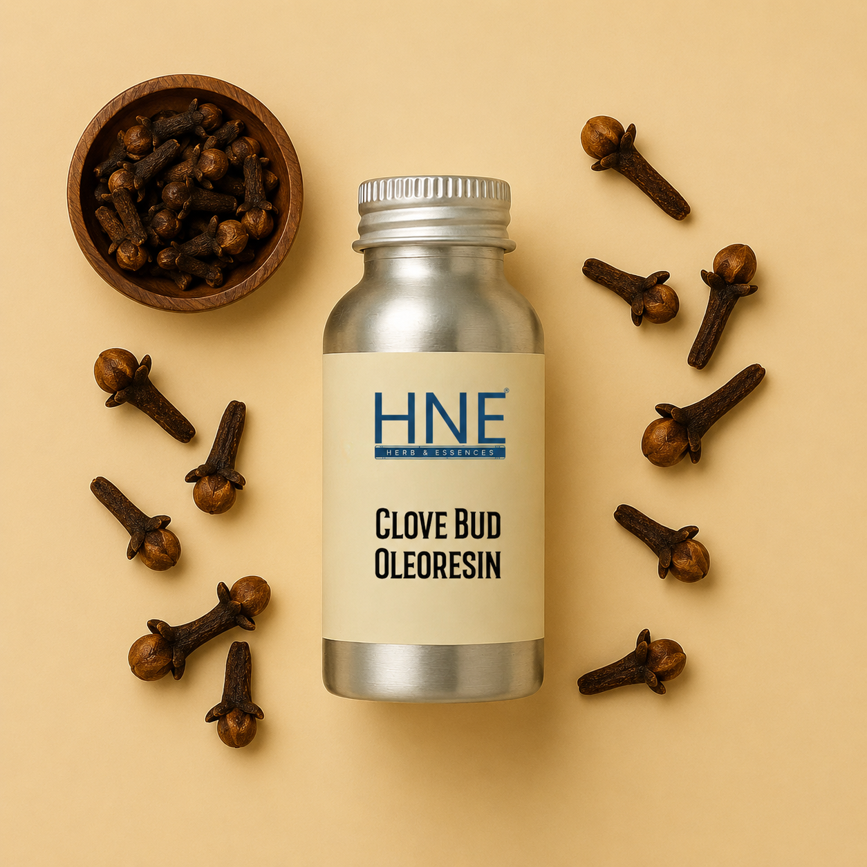 Bottle of HNE Clove Bud Oleoresin with cloves on a beige background