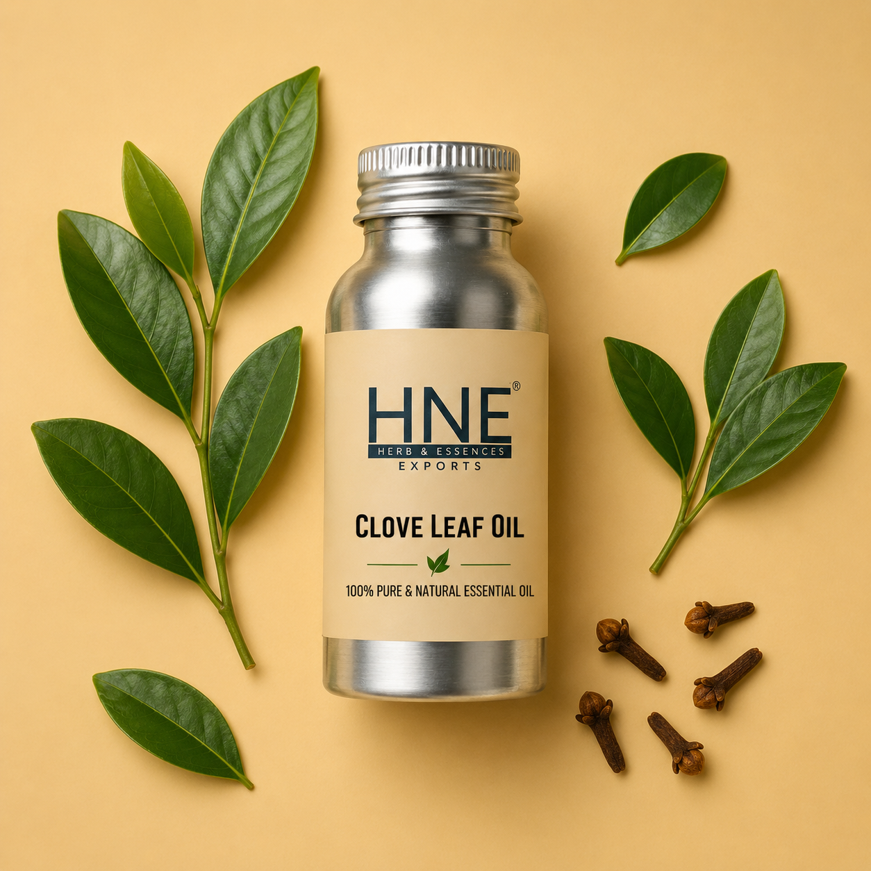 Bottle of HNE Clove Leaf Oil with clove leaves and cloves on a beige background