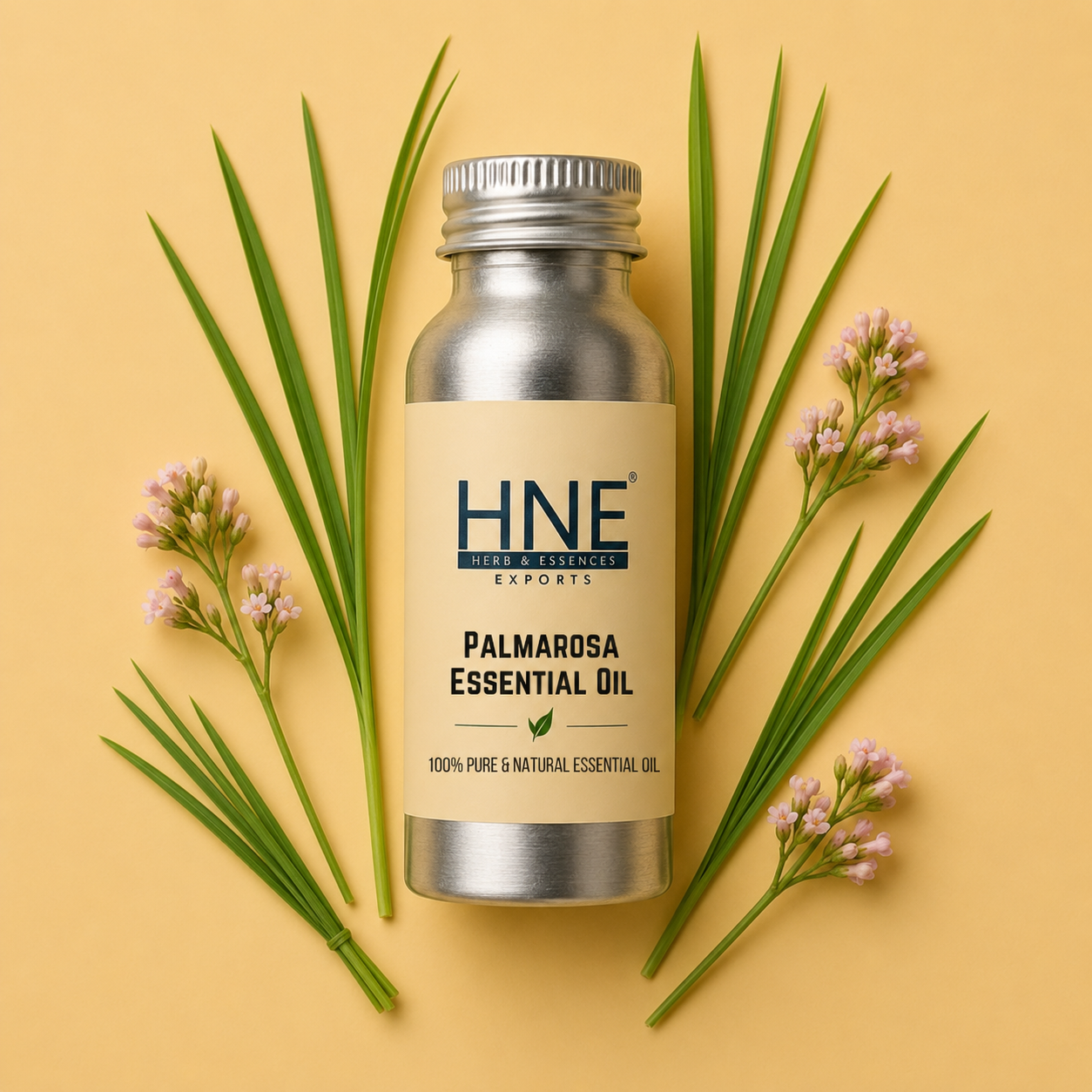Bottle of HNE Palmarosa Essential Oil with green leaves and flowers on a yellow background