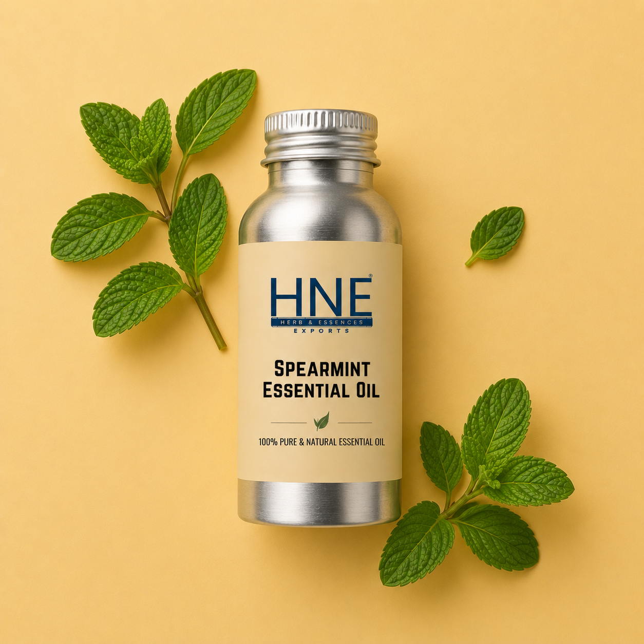 Spearmint essential oil bottle with leaves on a yellow background