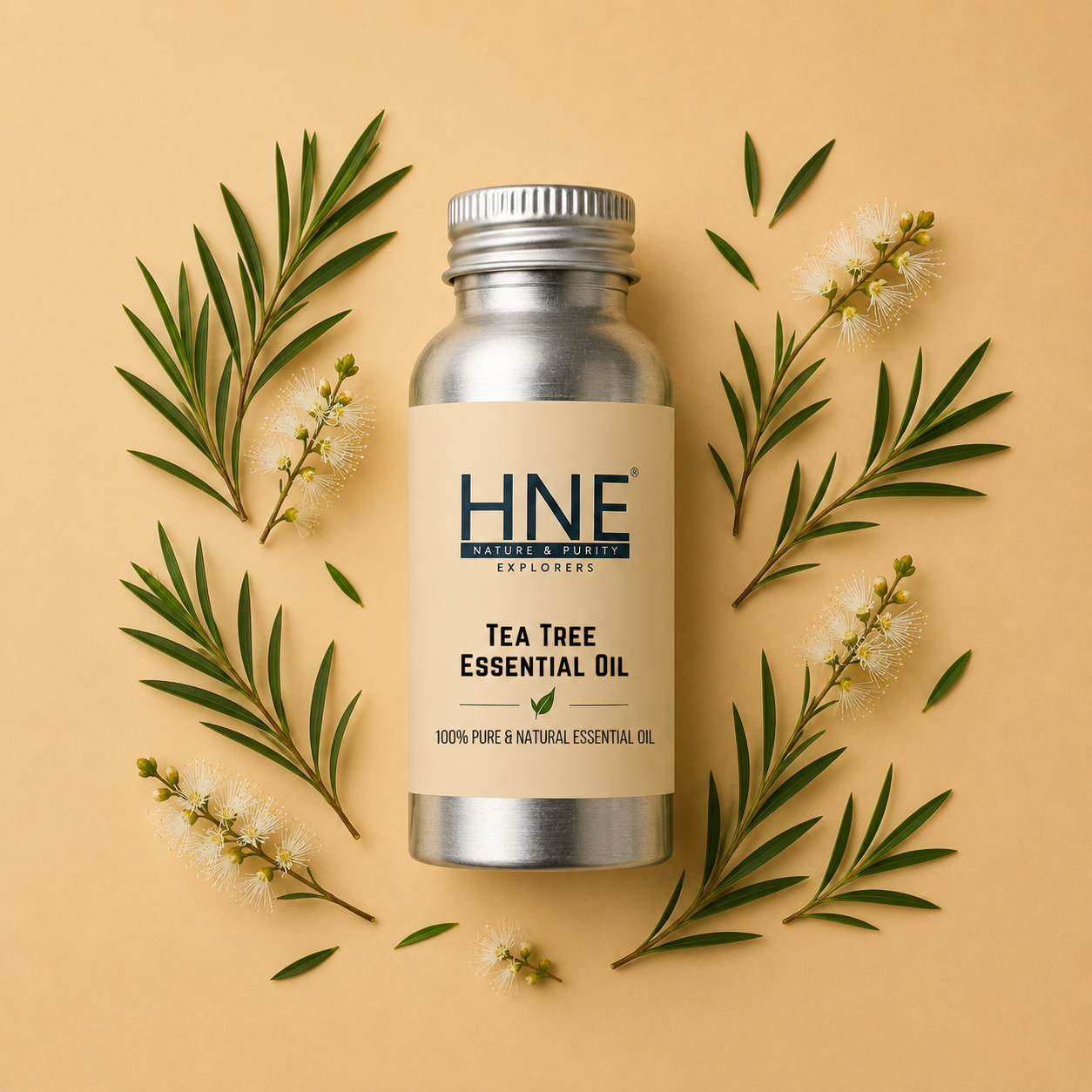 Tea tree essential oil bottle with leaves and flowers on a beige background