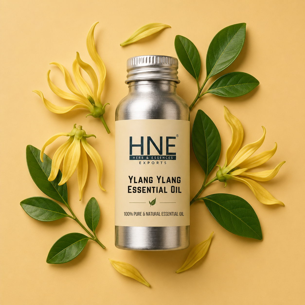 Ylang ylang essential oil bottle with flowers and leaves on a yellow background